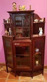 Love this unusual curio cabinet