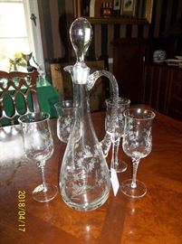 wine decanter with stopper and hand attached twist handle and four twist stem wine glasses