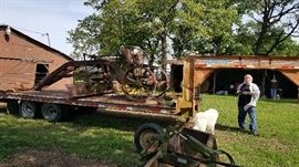 kayln gooseneck trailer also on trailer is caterpillar  antique grader