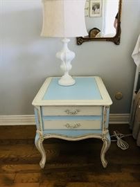 Two blue and white nightstands with matching lamps