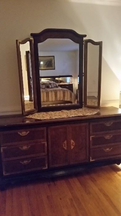 Triple dresser with mirror, 3 drawers behind middle doors. 
