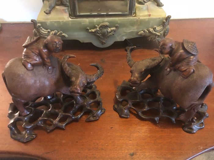 Pair of carved boxwood wood water buffaloes with farmers on their back - with fitted stands
