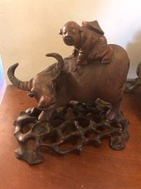 Carved Chinese bull with farmer on its back - with stand
