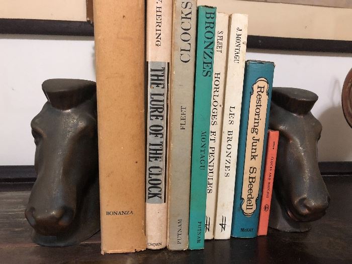 Horse head bookends and old books