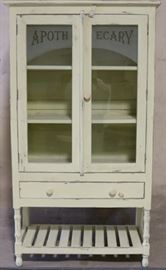 Apothecary cabinet in yellow