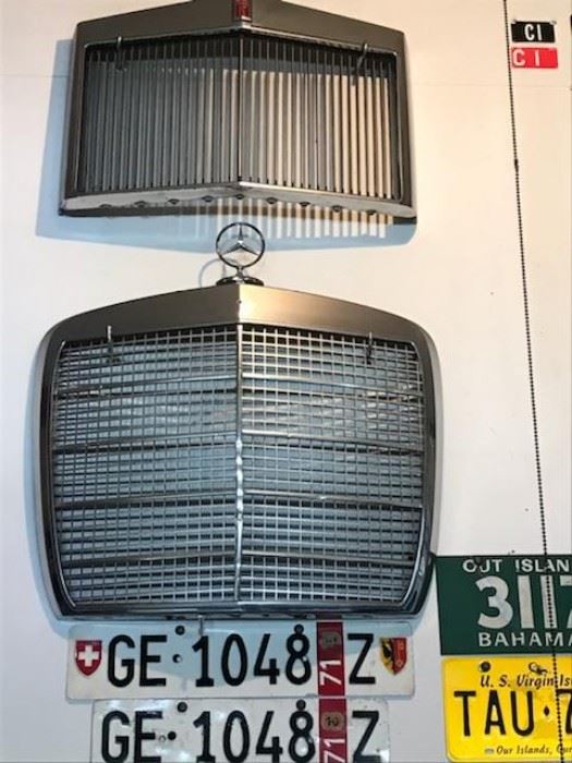 Vintage Lincoln Continental and Mercedes Benz grills,  Swiss license plates, Bahamas and U.S. Virgin Island plates.