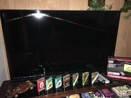 Vizio 48" TV + Tabacco tins