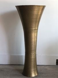 Hand-hammered brass decorative vases. Antique brass finish. Base has been weighted for stability. Dimensions 10ʺW × 10ʺD × 36ʺH