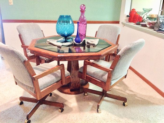 Very Nice Octagon Wood/Glass Dining Table with 4 Rolling Chairs in Excellent Condition.