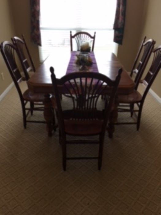 Dining room table with eight chairs.