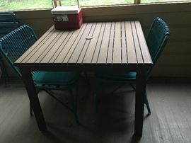 outdoor table pair of rattan chairs