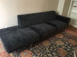 Indigo blue contemporary sofa with chrome legs.