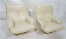 Lot 655 Pr Beige Leather Swivel Lounge Chairs. Completely