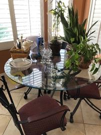 glass-topped dinette set with matching bar stools
