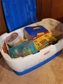 Little Tykes toy box filled with games/toys.