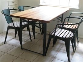 Pottery Barn teak and painted metal breakfast table with four chairs.