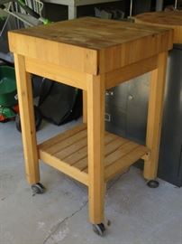 Butcher block table on casters.