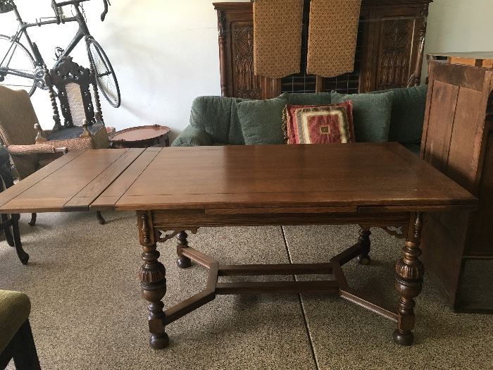 Dining table with fold out side leafs, and a set of  6 matching chairs. 