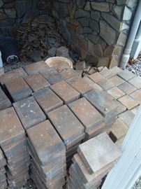 Square and rectangular paving stones.  Also, some stone seen in background.  Dimensions are approx. 9 x 6 x 2 and 6 x 6 inches.  120 of the smaller ones and  200 or so of the larger ones.