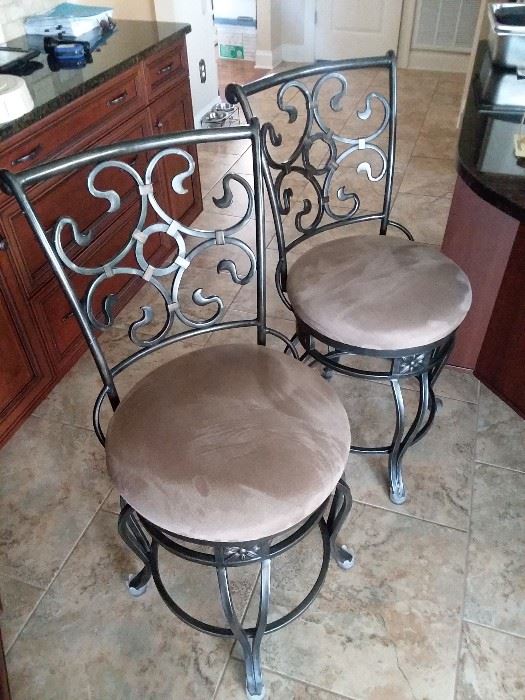 Kitchen counter stools.  Nice and heavy. 360 degree swivel.