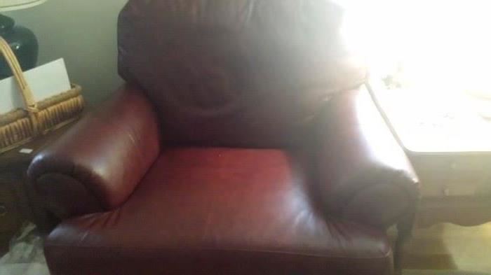 Leather arm chair with ottoman in like new condition