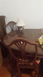Pennsylvania House dining table with 3 leaves and pads and 4 chairs.  Great condition.  