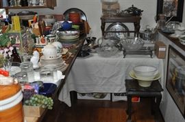 Plates and mugs and bowls and trays, small caned stool, silver-plate, crystal, glassware, little table, art, Princess House