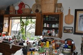 Baskets, plates and mugs and bowls and trays, glassware, canisters, serving pieces, kitchen utensils, microwave, platters, pitchers, sets of china