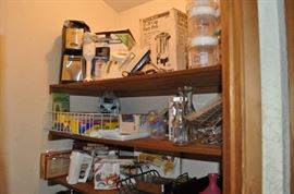 Pantry full of goodies, coffee pots, mixer, lender, racks