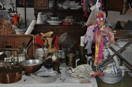 Baskets, seashells, copper molds, copper round tray, treen cup and saucer, large copper Mayan calendar plate, huge ladle, copper Dutch oven, brass crumb tray, copper colander, large shell oblong pottery bowl signed, copper utensils, tile, candle holders, studio pottery fish motifaskets, seashells, copper molds, copper round tray, treen cup and saucer, large copper Mayan calendar plate, huge ladle, copper Dutch oven, brass crumb tray, copper colander, large shell oblong pottery bowl signed, copper utensils, tile, candle holders, studio pottery fish motif, set of dishes, whimsical handmade dolls, English brass planters, 