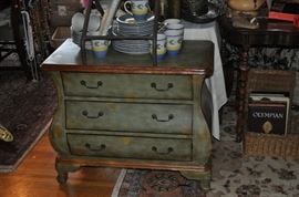 Set of china on a sweet painted Bombe chest (one of two)