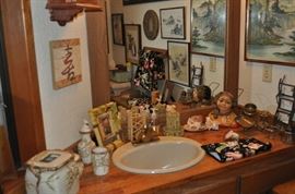 Yes... it's a bathroom and it's full of all sorts of cool stuff... look at that 'bust' in the corner!  All of the walls are full of art, there's a very cool painted Bombe chest and even an awesome little hand-painted Italian table