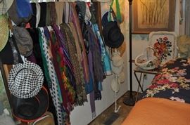 I think she belonged to the Scarf-of-the-Day Club!!!  We've created a double curtain of scarves thanks to a  couple of tension shower rods...  A couple of vintage TV trays, a floor lamp, some art on the wall, a few hats...