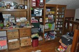 This is the library just outside of that enormous master bedroom.  FULL of books and office supplies, cups and saucers, folders, magazine holders, photo boxes, printers, scissors, greeting cards, some fine porcelain, lots of old cigar boxes, an office chair... a vintage typewriter, paper, a monitor, oodles of pens and pencils, staplers, tape dispensers, more books, envelopes, an awesome fish decanter, a Wild Turkey decanter, and... there is really a LOT more!
