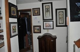 Just some of the TONS of art that's plastered all over the walls!  That's a cute little cabinet too... has a great look, but I suspect it's an Indonesian piece manufactured in the 80s or 90s.  Still... functional and cute