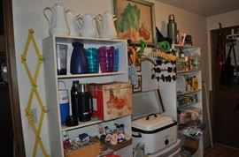 This laundry room is huge and it's packed with goodies.  More of those party supplies!  pitchers and bins and thermoses and Rit dye and shoe polish and and and...