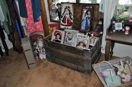 The girls' room... totally set up for her two adorable grandchildren.  That is an amazing antique Thomasville vanity with mirror, a pair of twin spool beds covered with quilts and other treasures... loads of art on the walls, an antique armoire, the best ever antique rocking chair, a spinet desk, and a trunk (antique) full of porcelain dolls.  Oh... and a closet full of more clothes, bedding, a corner etagere... and more stuff I can't remember!