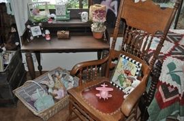The girls' room... totally set up for her two adorable grandchildren.  That is an amazing antique Thomasville vanity with mirror, a pair of twin spool beds covered with quilts and other treasures... loads of art on the walls, an antique armoire, the best ever antique rocking chair, a spinet desk, and a trunk (antique) full of porcelain dolls.  Oh... and a closet full of more clothes, bedding, a corner etagere... and more stuff I can't remember!