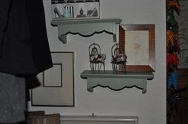 The girls' room... totally set up for her two adorable grandchildren.  That is an amazing antique Thomasville vanity with mirror, a pair of twin spool beds covered with quilts and other treasures... loads of art on the walls, an antique armoire, the best ever antique rocking chair, a spinet desk, and a trunk (antique) full of porcelain dolls.  Oh... and a closet full of more clothes, bedding, a corner etagere... and more stuff I can't remember!