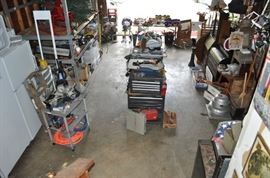 And now the garage... the garage EVERY guy wants to own... nearly 800sf and pretty close to two stories tall!   5ft stainless junction box, air tools, animated 5ft santa, Aquaflow pump, building supplies, camping supplies, Christmas and holiday items, cleaning supplies, commercial painting equipment and supplies, contractor’s equipment, Craftsman tool boxes, extensions cords, fishing collectibles antique and vintage, fishing equipment new and old, fishing rods and reels, garden art TONS, garden fertilizers and more, gardening supplies and tools hundreds, Imperial 6 burner stove/oven, ladders, Livingston 2 person fiberglass boat, loading ramps, Lorex cookware fan, Minnkota trolling motor, outdoor pots, paint sprayers, pet supplies, picnic table, plants, plastic bins all sizes, plumbing supplies, refrigerator, secretary with glass doors above drop front with drawers, front with drawers, Zero gravity outdoor chair… and the regular stuff – saws, hammers, wrenches, plumbing stuff, screwdriv