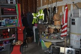 And now the garage... the garage EVERY guy wants to own... nearly 800sf and pretty close to two stories tall!   5ft stainless junction box, air tools, animated 5ft santa, Aquaflow pump, building supplies, camping supplies, Christmas and holiday items, cleaning supplies, commercial painting equipment and supplies, contractor’s equipment, Craftsman tool boxes, extensions cords, fishing collectibles antique and vintage, fishing equipment new and old, fishing rods and reels, garden art TONS, garden fertilizers and more, gardening supplies and tools hundreds, Imperial 6 burner stove/oven, ladders, Livingston 2 person fiberglass boat, loading ramps, Lorex cookware fan, Minnkota trolling motor, outdoor pots, paint sprayers, pet supplies, picnic table, plants, plastic bins all sizes, plumbing supplies, refrigerator, secretary with glass doors above drop front with drawers, front with drawers, Zero gravity outdoor chair… and the regular stuff – saws, hammers, wrenches, plumbing stuff, screwdriv