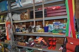 And now the garage... the garage EVERY guy wants to own... nearly 800sf and pretty close to two stories tall!   5ft stainless junction box, air tools, animated 5ft santa, Aquaflow pump, building supplies, camping supplies, Christmas and holiday items, cleaning supplies, commercial painting equipment and supplies, contractor’s equipment, Craftsman tool boxes, extensions cords, fishing collectibles antique and vintage, fishing equipment new and old, fishing rods and reels, garden art TONS, garden fertilizers and more, gardening supplies and tools hundreds, Imperial 6 burner stove/oven, ladders, Livingston 2 person fiberglass boat, loading ramps, Lorex cookware fan, Minnkota trolling motor, outdoor pots, paint sprayers, pet supplies, picnic table, plants, plastic bins all sizes, plumbing supplies, refrigerator, secretary with glass doors above drop front with drawers, front with drawers, Zero gravity outdoor chair… and the regular stuff – saws, hammers, wrenches, plumbing stuff, screwdriv