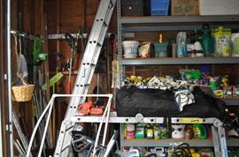 And now the garage... the garage EVERY guy wants to own... nearly 800sf and pretty close to two stories tall!   5ft stainless junction box, air tools, animated 5ft santa, Aquaflow pump, building supplies, camping supplies, Christmas and holiday items, cleaning supplies, commercial painting equipment and supplies, contractor’s equipment, Craftsman tool boxes, extensions cords, fishing collectibles antique and vintage, fishing equipment new and old, fishing rods and reels, garden art TONS, garden fertilizers and more, gardening supplies and tools hundreds, Imperial 6 burner stove/oven, ladders, Livingston 2 person fiberglass boat, loading ramps, Lorex cookware fan, Minnkota trolling motor, outdoor pots, paint sprayers, pet supplies, picnic table, plants, plastic bins all sizes, plumbing supplies, refrigerator, secretary with glass doors above drop front with drawers, front with drawers, Zero gravity outdoor chair… and the regular stuff – saws, hammers, wrenches, plumbing stuff, screwdriv