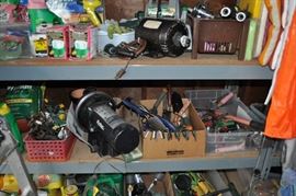 And now the garage... the garage EVERY guy wants to own... nearly 800sf and pretty close to two stories tall!   5ft stainless junction box, air tools, animated 5ft santa, Aquaflow pump, building supplies, camping supplies, Christmas and holiday items, cleaning supplies, commercial painting equipment and supplies, contractor’s equipment, Craftsman tool boxes, extensions cords, fishing collectibles antique and vintage, fishing equipment new and old, fishing rods and reels, garden art TONS, garden fertilizers and more, gardening supplies and tools hundreds, Imperial 6 burner stove/oven, ladders, Livingston 2 person fiberglass boat, loading ramps, Lorex cookware fan, Minnkota trolling motor, outdoor pots, paint sprayers, pet supplies, picnic table, plants, plastic bins all sizes, plumbing supplies, refrigerator, secretary with glass doors above drop front with drawers, front with drawers, Zero gravity outdoor chair… and the regular stuff – saws, hammers, wrenches, plumbing stuff, screwdriv