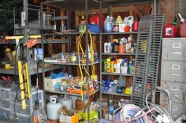 And now the garage... the garage EVERY guy wants to own... nearly 800sf and pretty close to two stories tall!   5ft stainless junction box, air tools, animated 5ft santa, Aquaflow pump, building supplies, camping supplies, Christmas and holiday items, cleaning supplies, commercial painting equipment and supplies, contractor’s equipment, Craftsman tool boxes, extensions cords, fishing collectibles antique and vintage, fishing equipment new and old, fishing rods and reels, garden art TONS, garden fertilizers and more, gardening supplies and tools hundreds, Imperial 6 burner stove/oven, ladders, Livingston 2 person fiberglass boat, loading ramps, Lorex cookware fan, Minnkota trolling motor, outdoor pots, paint sprayers, pet supplies, picnic table, plants, plastic bins all sizes, plumbing supplies, refrigerator, secretary with glass doors above drop front with drawers, front with drawers, Zero gravity outdoor chair… and the regular stuff – saws, hammers, wrenches, plumbing stuff, screwdriv