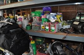 And now the garage... the garage EVERY guy wants to own... nearly 800sf and pretty close to two stories tall!   5ft stainless junction box, air tools, animated 5ft santa, Aquaflow pump, building supplies, camping supplies, Christmas and holiday items, cleaning supplies, commercial painting equipment and supplies, contractor’s equipment, Craftsman tool boxes, extensions cords, fishing collectibles antique and vintage, fishing equipment new and old, fishing rods and reels, garden art TONS, garden fertilizers and more, gardening supplies and tools hundreds, Imperial 6 burner stove/oven, ladders, Livingston 2 person fiberglass boat, loading ramps, Lorex cookware fan, Minnkota trolling motor, outdoor pots, paint sprayers, pet supplies, picnic table, plants, plastic bins all sizes, plumbing supplies, refrigerator, secretary with glass doors above drop front with drawers, front with drawers, Zero gravity outdoor chair… and the regular stuff – saws, hammers, wrenches, plumbing stuff, screwdriv