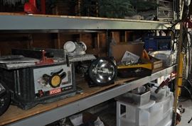 And now the garage... the garage EVERY guy wants to own... nearly 800sf and pretty close to two stories tall!   5ft stainless junction box, air tools, animated 5ft santa, Aquaflow pump, building supplies, camping supplies, Christmas and holiday items, cleaning supplies, commercial painting equipment and supplies, contractor’s equipment, Craftsman tool boxes, extensions cords, fishing collectibles antique and vintage, fishing equipment new and old, fishing rods and reels, garden art TONS, garden fertilizers and more, gardening supplies and tools hundreds, Imperial 6 burner stove/oven, ladders, Livingston 2 person fiberglass boat, loading ramps, Lorex cookware fan, Minnkota trolling motor, outdoor pots, paint sprayers, pet supplies, picnic table, plants, plastic bins all sizes, plumbing supplies, refrigerator, secretary with glass doors above drop front with drawers, front with drawers, Zero gravity outdoor chair… and the regular stuff – saws, hammers, wrenches, plumbing stuff, screwdriv