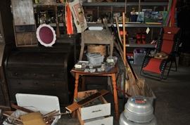 And now the garage... the garage EVERY guy wants to own... nearly 800sf and pretty close to two stories tall!   5ft stainless junction box, air tools, animated 5ft santa, Aquaflow pump, building supplies, camping supplies, Christmas and holiday items, cleaning supplies, commercial painting equipment and supplies, contractor’s equipment, Craftsman tool boxes, extensions cords, fishing collectibles antique and vintage, fishing equipment new and old, fishing rods and reels, garden art TONS, garden fertilizers and more, gardening supplies and tools hundreds, Imperial 6 burner stove/oven, ladders, Livingston 2 person fiberglass boat, loading ramps, Lorex cookware fan, Minnkota trolling motor, outdoor pots, paint sprayers, pet supplies, picnic table, plants, plastic bins all sizes, plumbing supplies, refrigerator, secretary with glass doors above drop front with drawers, front with drawers, Zero gravity outdoor chair… and the regular stuff – saws, hammers, wrenches, plumbing stuff, screwdriv