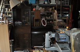 And now the garage... the garage EVERY guy wants to own... nearly 800sf and pretty close to two stories tall!   5ft stainless junction box, air tools, animated 5ft santa, Aquaflow pump, building supplies, camping supplies, Christmas and holiday items, cleaning supplies, commercial painting equipment and supplies, contractor’s equipment, Craftsman tool boxes, extensions cords, fishing collectibles antique and vintage, fishing equipment new and old, fishing rods and reels, garden art TONS, garden fertilizers and more, gardening supplies and tools hundreds, Imperial 6 burner stove/oven, ladders, Livingston 2 person fiberglass boat, loading ramps, Lorex cookware fan, Minnkota trolling motor, outdoor pots, paint sprayers, pet supplies, picnic table, plants, plastic bins all sizes, plumbing supplies, refrigerator, secretary with glass doors above drop front with drawers, front with drawers, Zero gravity outdoor chair… and the regular stuff – saws, hammers, wrenches, plumbing stuff, screwdriv