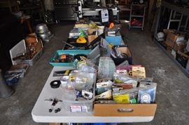 And now the garage... the garage EVERY guy wants to own... nearly 800sf and pretty close to two stories tall!   5ft stainless junction box, air tools, animated 5ft santa, Aquaflow pump, building supplies, camping supplies, Christmas and holiday items, cleaning supplies, commercial painting equipment and supplies, contractor’s equipment, Craftsman tool boxes, extensions cords, fishing collectibles antique and vintage, fishing equipment new and old, fishing rods and reels, garden art TONS, garden fertilizers and more, gardening supplies and tools hundreds, Imperial 6 burner stove/oven, ladders, Livingston 2 person fiberglass boat, loading ramps, Lorex cookware fan, Minnkota trolling motor, outdoor pots, paint sprayers, pet supplies, picnic table, plants, plastic bins all sizes, plumbing supplies, refrigerator, secretary with glass doors above drop front with drawers, front with drawers, Zero gravity outdoor chair… and the regular stuff – saws, hammers, wrenches, plumbing stuff, screwdriv